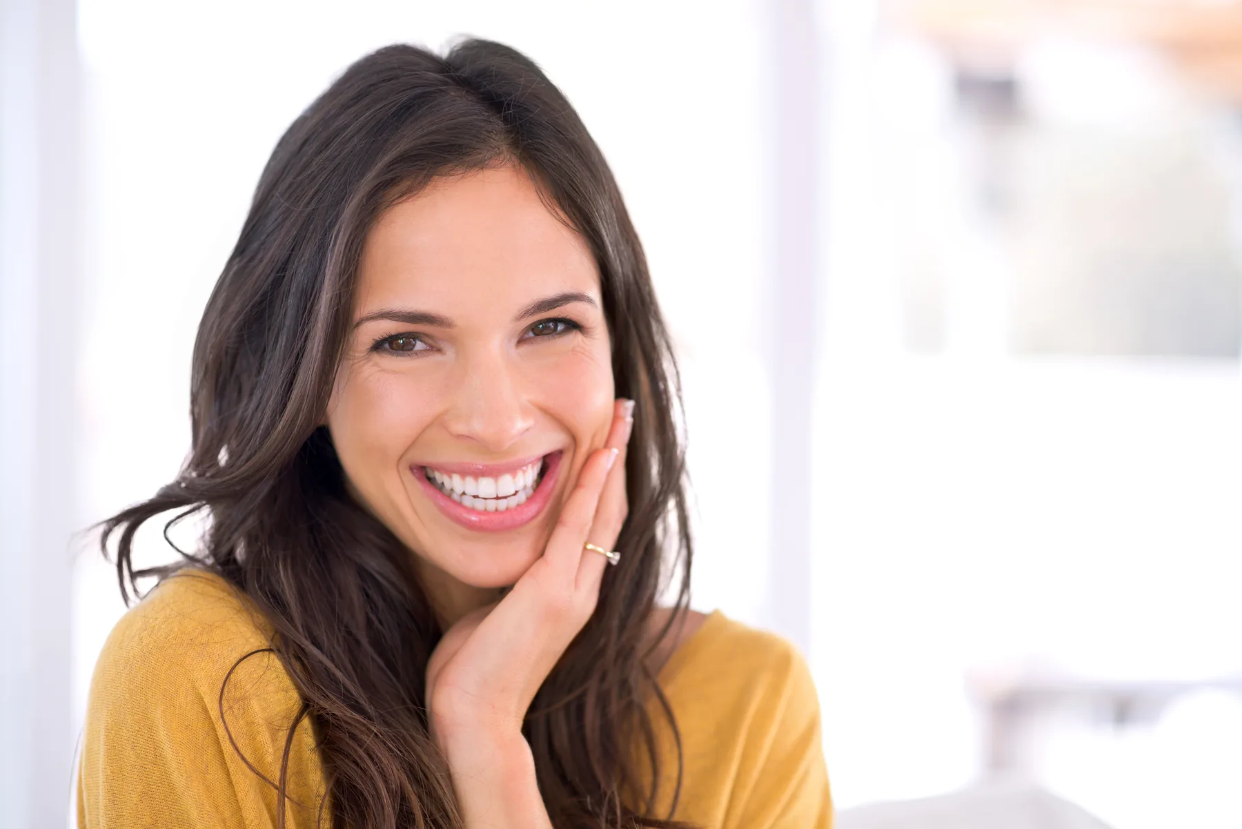 Smiling woman in a bright room